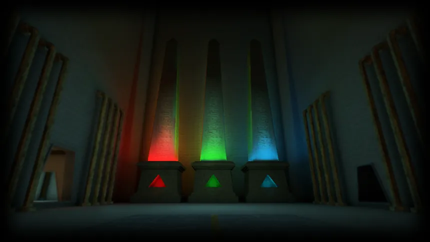 Tre obelischi illuminati di rosso, verde e blu su piedistalli con triangoli colorati